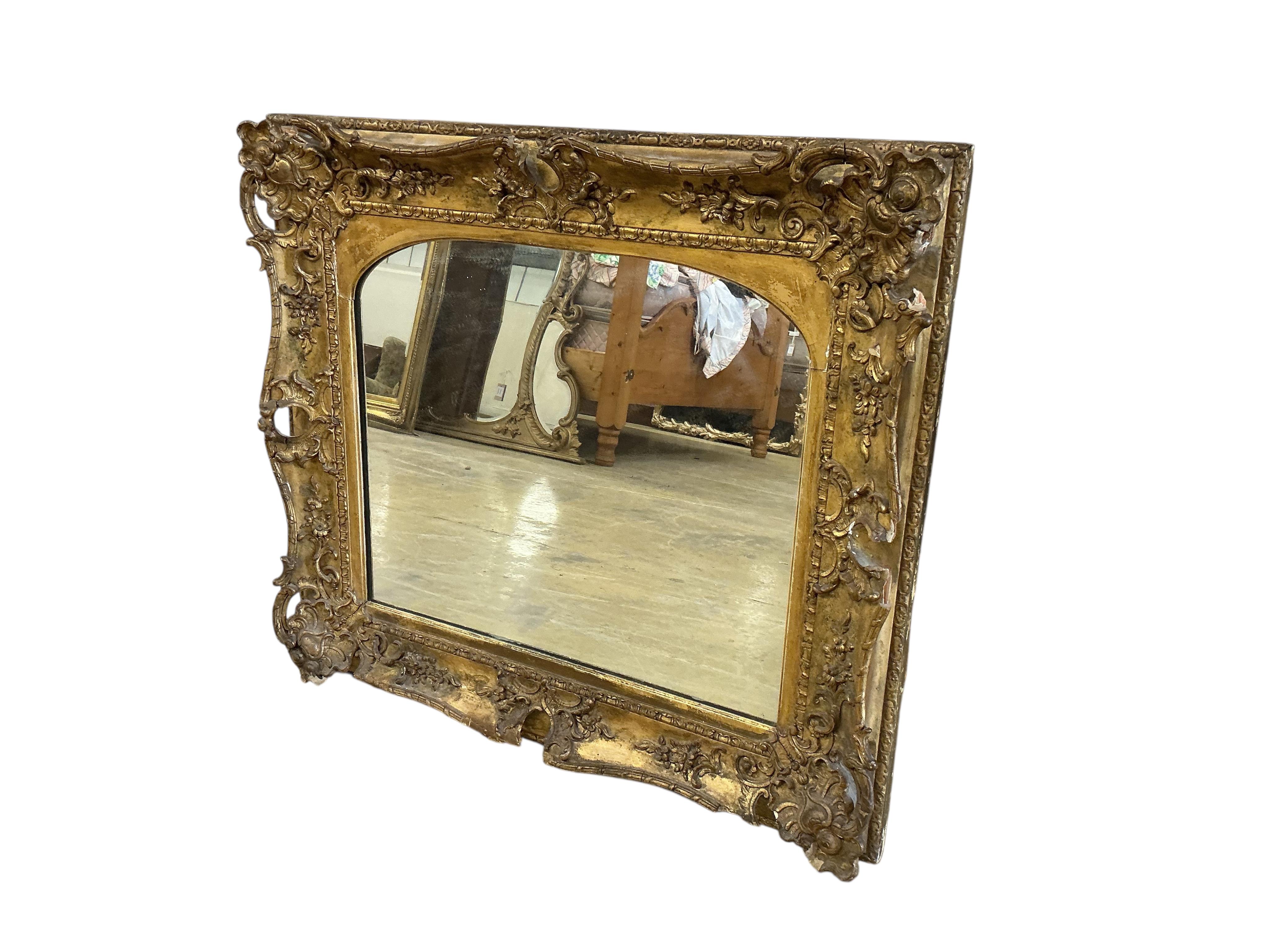 A Victorian giltwood and composition wall mirror converted from a picture frame, width 86cm, height 75cm